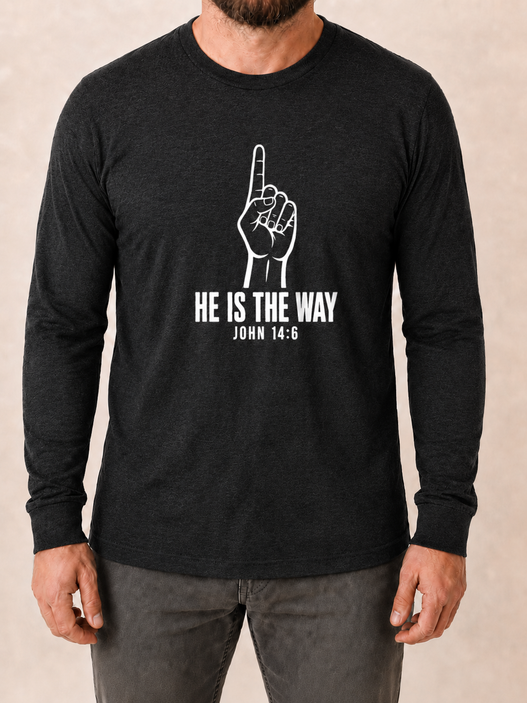 He Is the Way John 14:6 Bella+Canvas 3501CVC Black Heather long sleeve with Pure White artwork, approved male front studio view