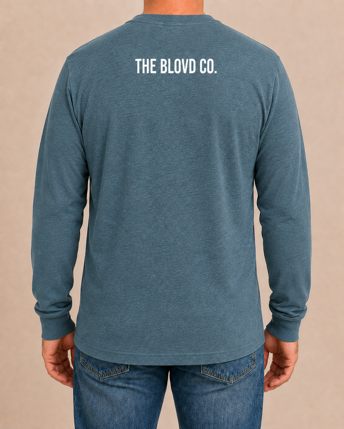THE BLOVD Lion Classic Bella+Canvas 3501CVC Heather Deep Teal long sleeve with True White upper-back mark, approved male rear studio view