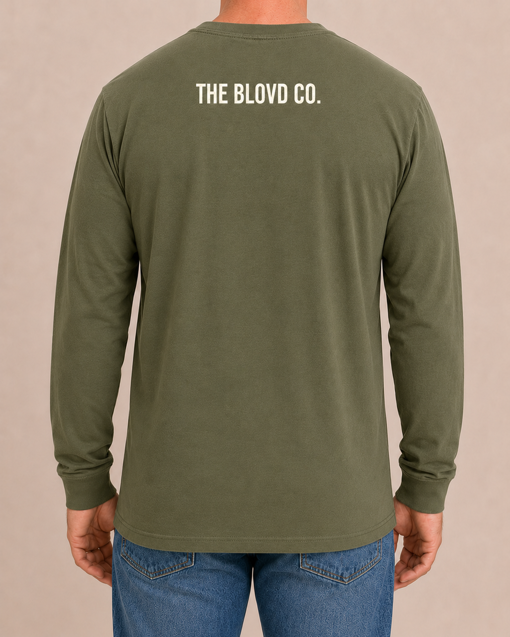 THE BLOVD Lion Classic Bella+Canvas 3501 Military Green long sleeve with Warm Ivory upper-back mark, approved male rear studio view