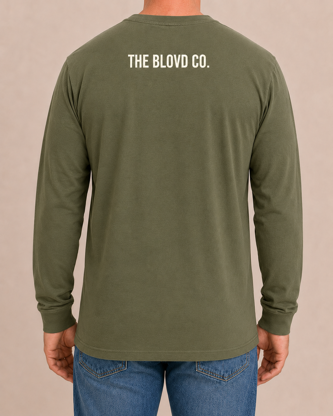 THE BLOVD Lion Classic Bella+Canvas 3501 Military Green long sleeve with Warm Ivory upper-back mark, approved male rear studio view