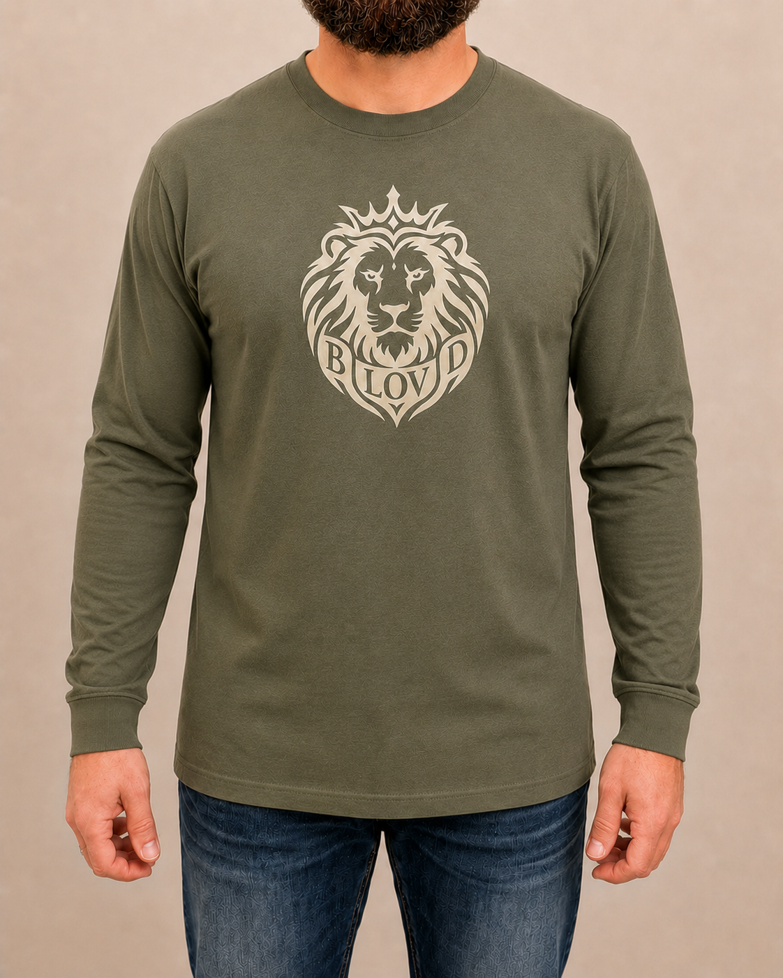 THE BLOVD Lion Classic Bella+Canvas 3501 Military Green long sleeve with Warm Ivory artwork, approved male front studio view
