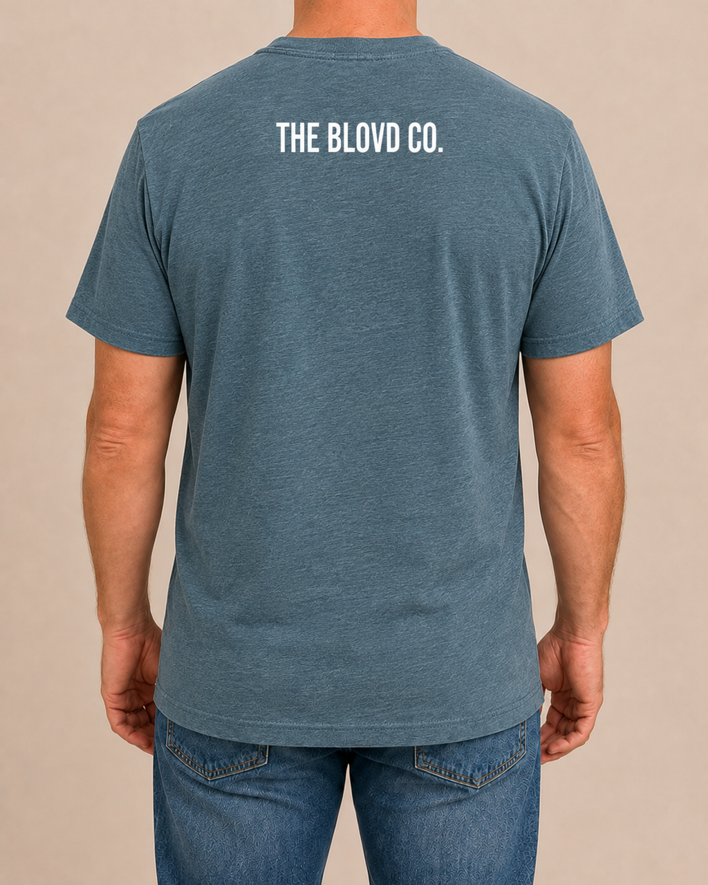 THE BLOVD Lion Classic on Bella+Canvas 3001CVC Heather Deep Teal with True White upper-back mark, male rear view