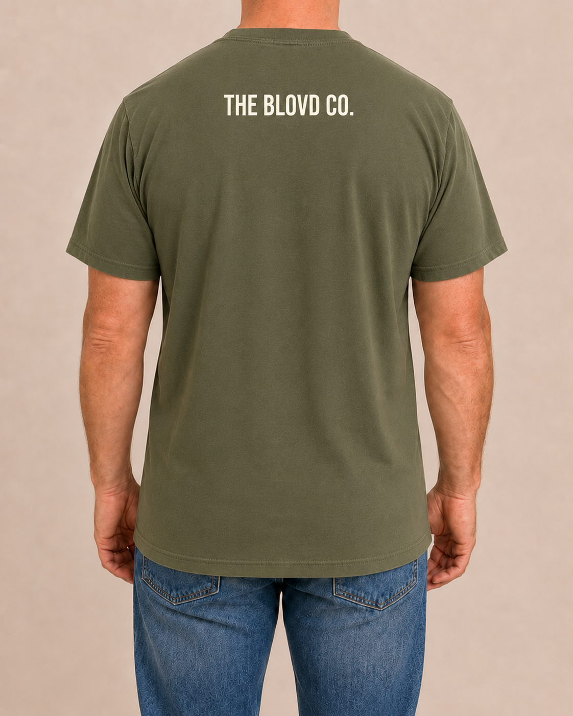 THE BLOVD Lion Classic on Bella+Canvas 3001 Military Green with Warm Ivory upper-back mark, male rear view