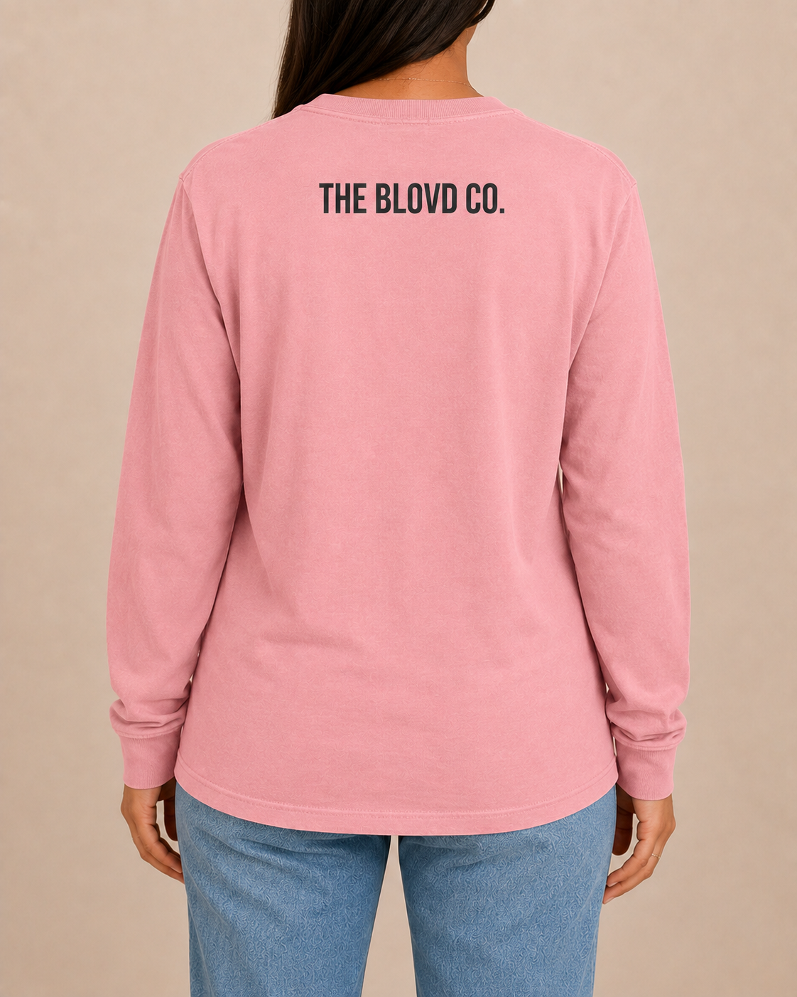THE BLOVD Lion Classic Comfort Colors 6014 Blossom long sleeve with Deep Charcoal THE BLOVD CO. upper-back mark, approved female rear studio view