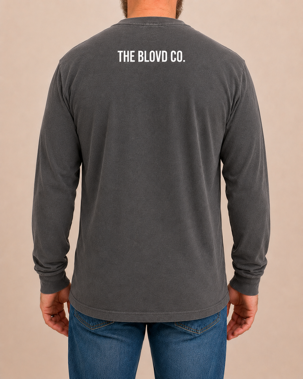 THE BLOVD Lion Classic Comfort Colors 6014 Pepper long sleeve with white THE BLOVD CO. upper-back mark, approved male rear studio view