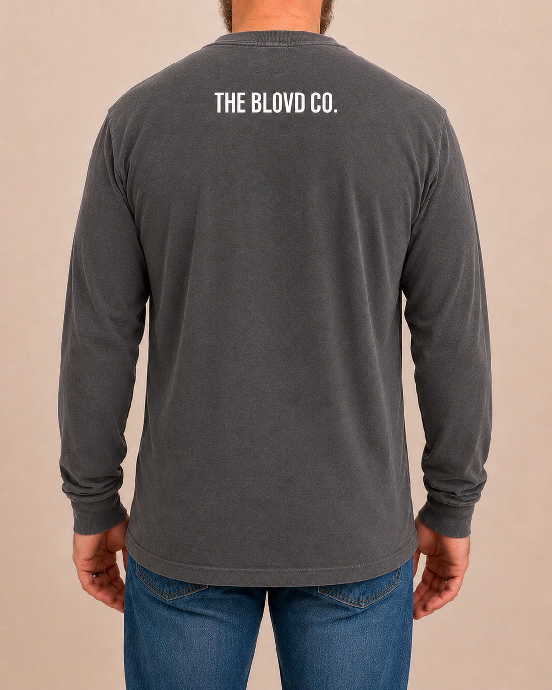 THE BLOVD Lion Classic Comfort Colors 6014 Pepper long sleeve with white THE BLOVD CO. upper-back mark, approved male rear studio view