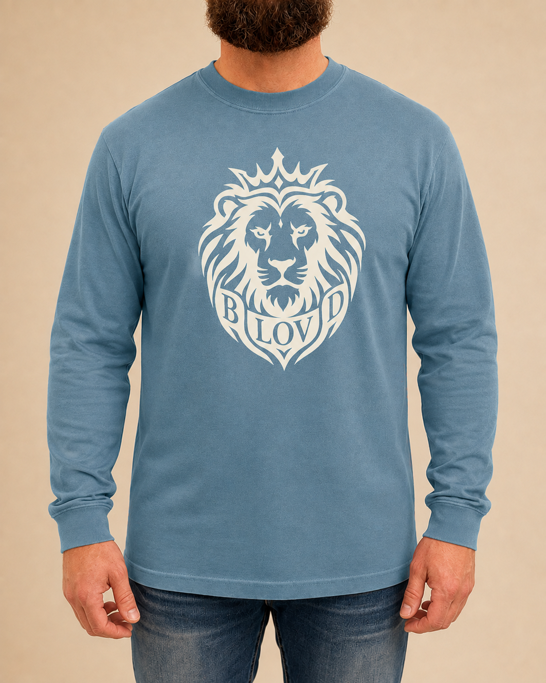 THE BLOVD Lion Signature Comfort Colors 6014 Blue Jean long sleeve with Warm Ivory Lion artwork, approved male front studio view