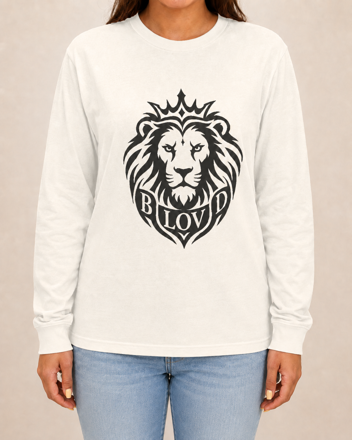 THE BLOVD Lion Signature Comfort Colors 6014 Ivory long sleeve with Deep Charcoal Lion artwork, approved female front studio view with jeans