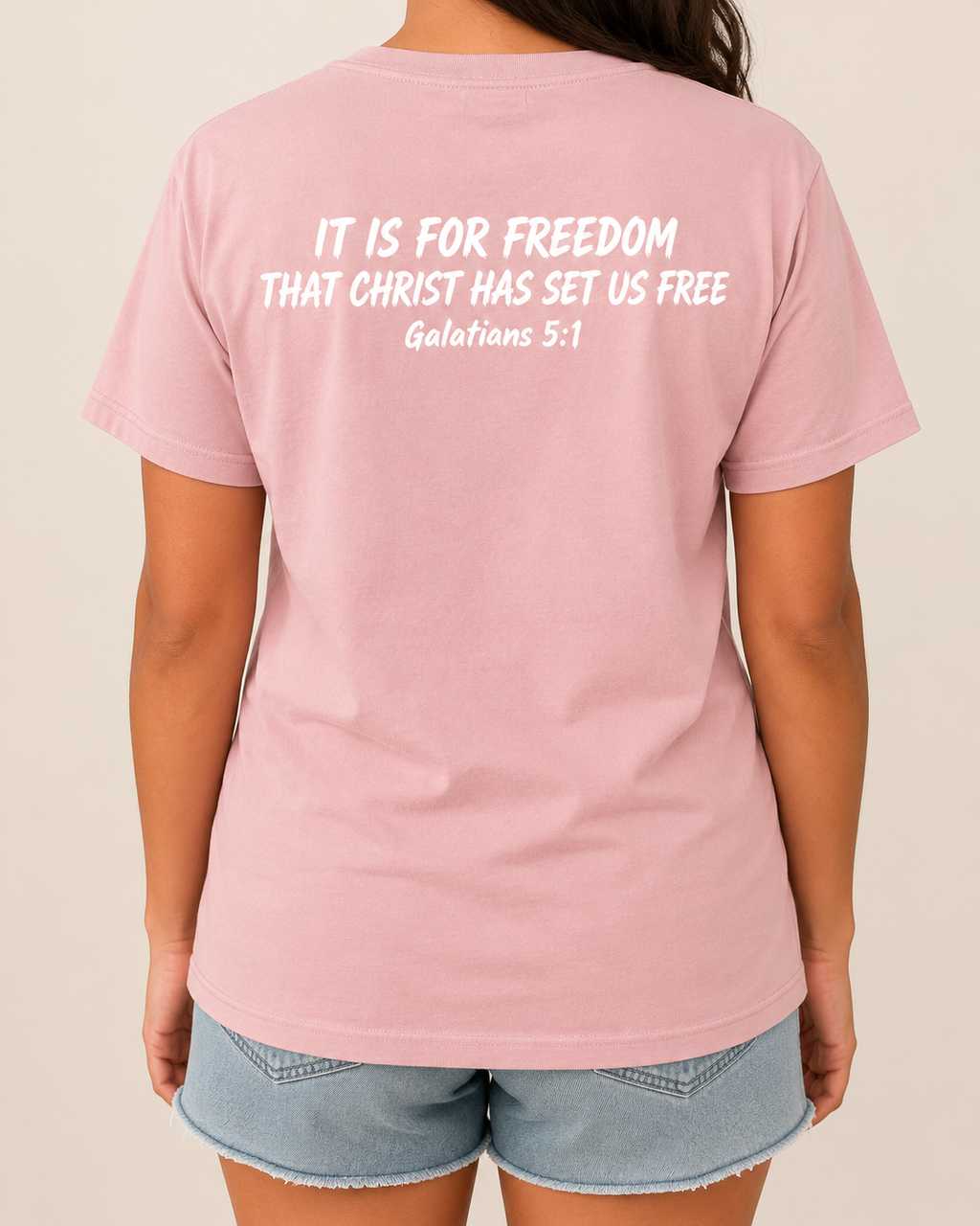Freedom Galatians 5:1 Comfort Colors Blossom tee with BLOVD Heritage Burgundy Scripture artwork, approved female warm-neutral studio back view showing the back of the neck.