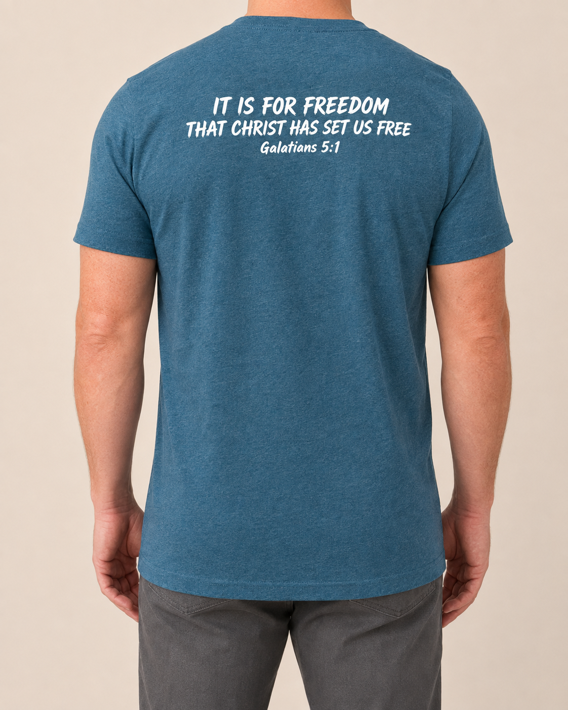 Freedom Galatians 5:1 Bella+Canvas Heather Deep Teal tee with BLOVD Pure White Scripture artwork, approved male warm-neutral studio back view showing the back of the neck.