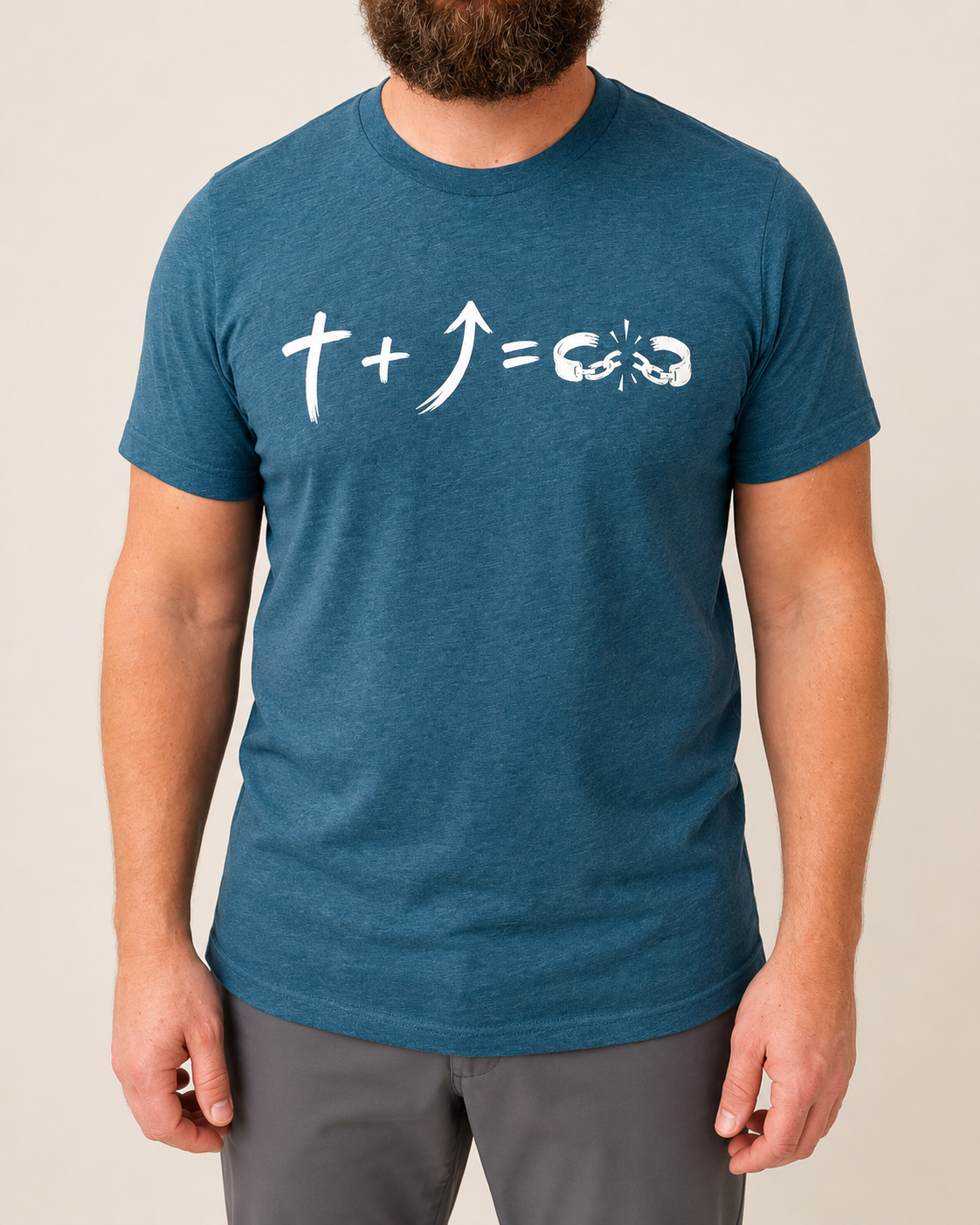 Freedom Galatians 5:1 Bella+Canvas Heather Deep Teal tee with BLOVD Pure White artwork, approved male warm-neutral studio front view cropped below the lips.