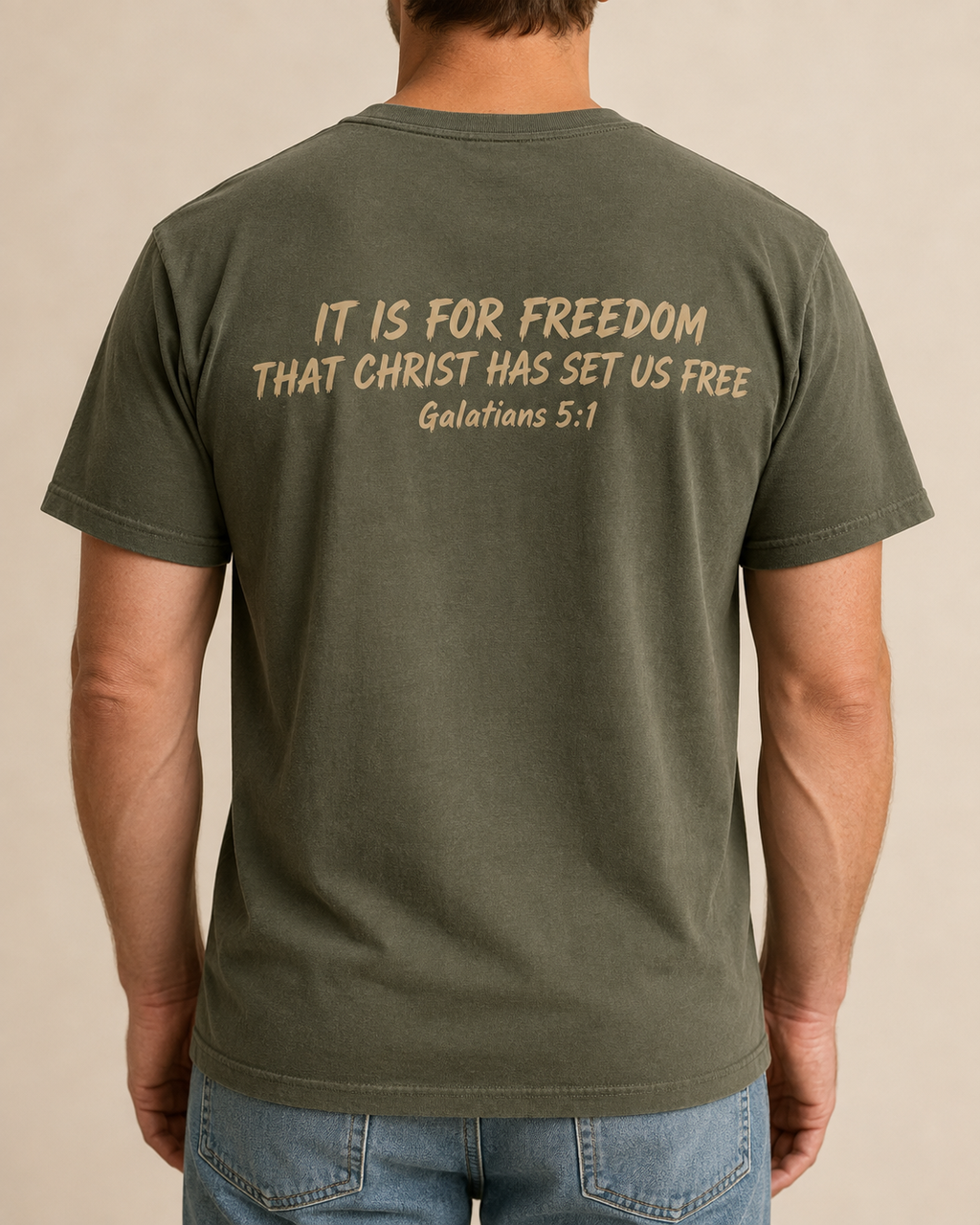 Freedom Galatians 5:1 Comfort Colors Moss tee with BLOVD Coyote Tan Scripture artwork, approved male warm-neutral studio back view showing the back of the neck.