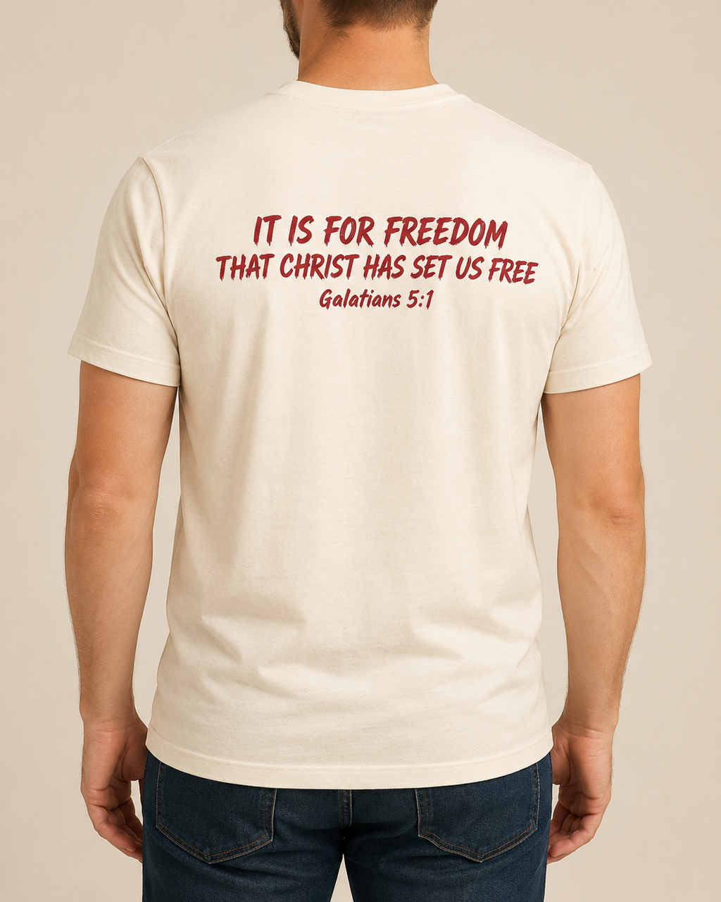 Freedom Galatians 5:1 Bella+Canvas Natural tee with BLOVD Crimson Scripture artwork, approved male warm-neutral studio back view showing the back of the neck.