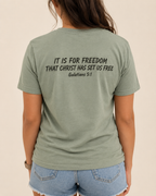 Freedom | Galatians 5:1 Sage Bella+Canvas tee with Weathered Espresso Scripture artwork, modeled back view