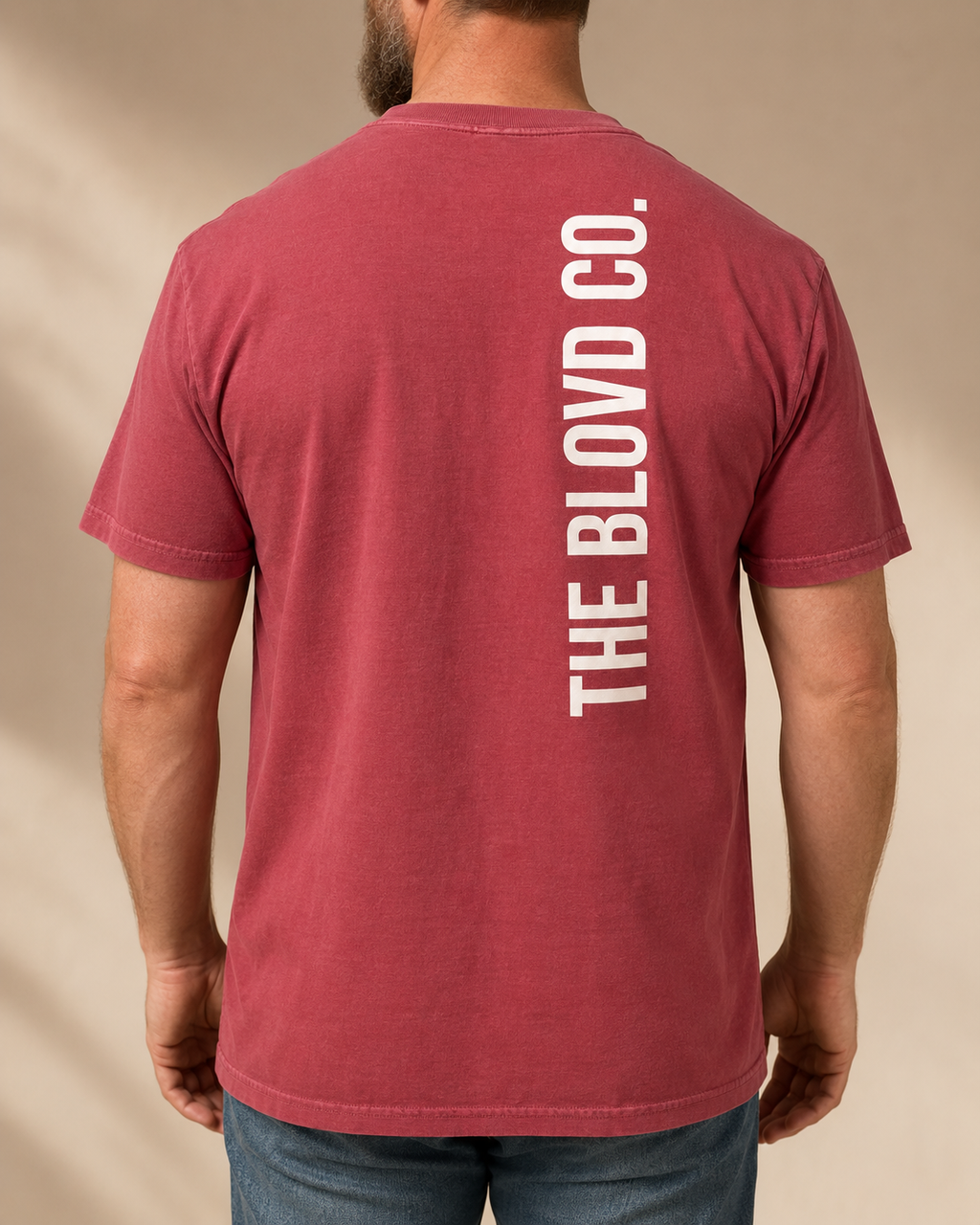 THE BLOVD Lion Signature Crimson T-shirt, back studio view featuring the vertical wordmark