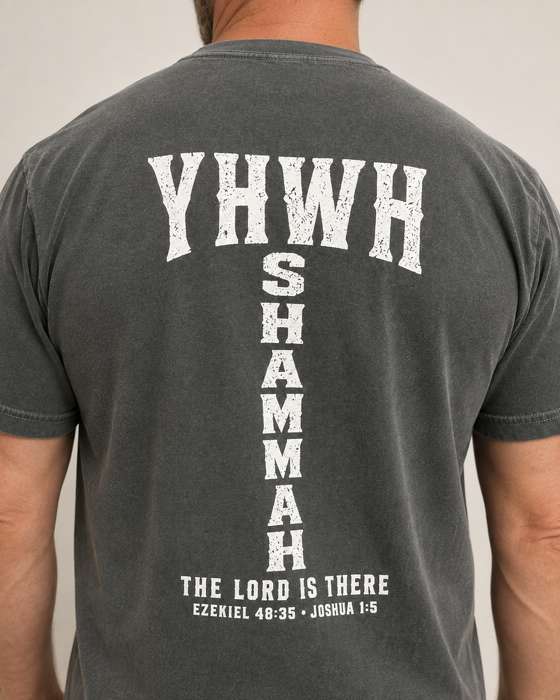YHWH SHAMMAH Pepper Comfort Colors tee, approved male warm-neutral studio back view