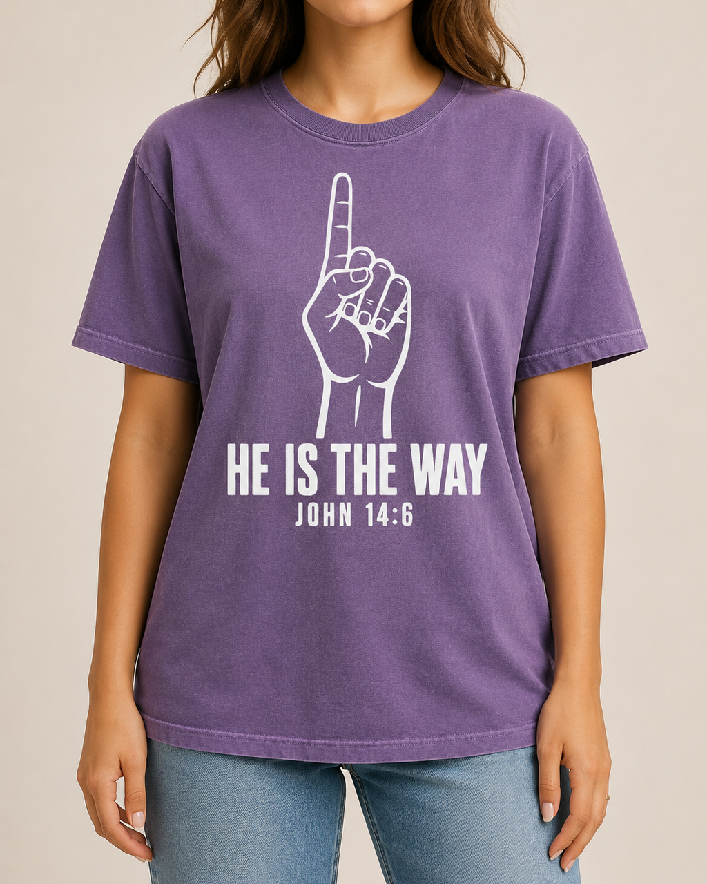 Female model cropped below the mouth, straight-on studio view, wearing Comfort Colors Violet He Is the Way shirt with BLOVD Pure White artwork.