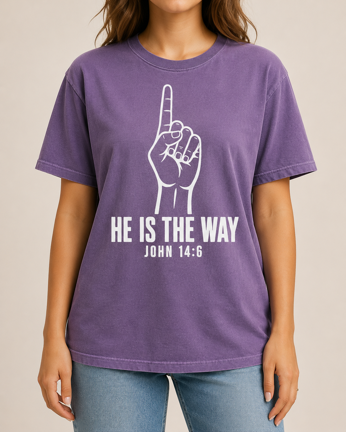 Female model cropped below the mouth, straight-on studio view, wearing Comfort Colors Violet He Is the Way shirt with BLOVD Pure White artwork.
